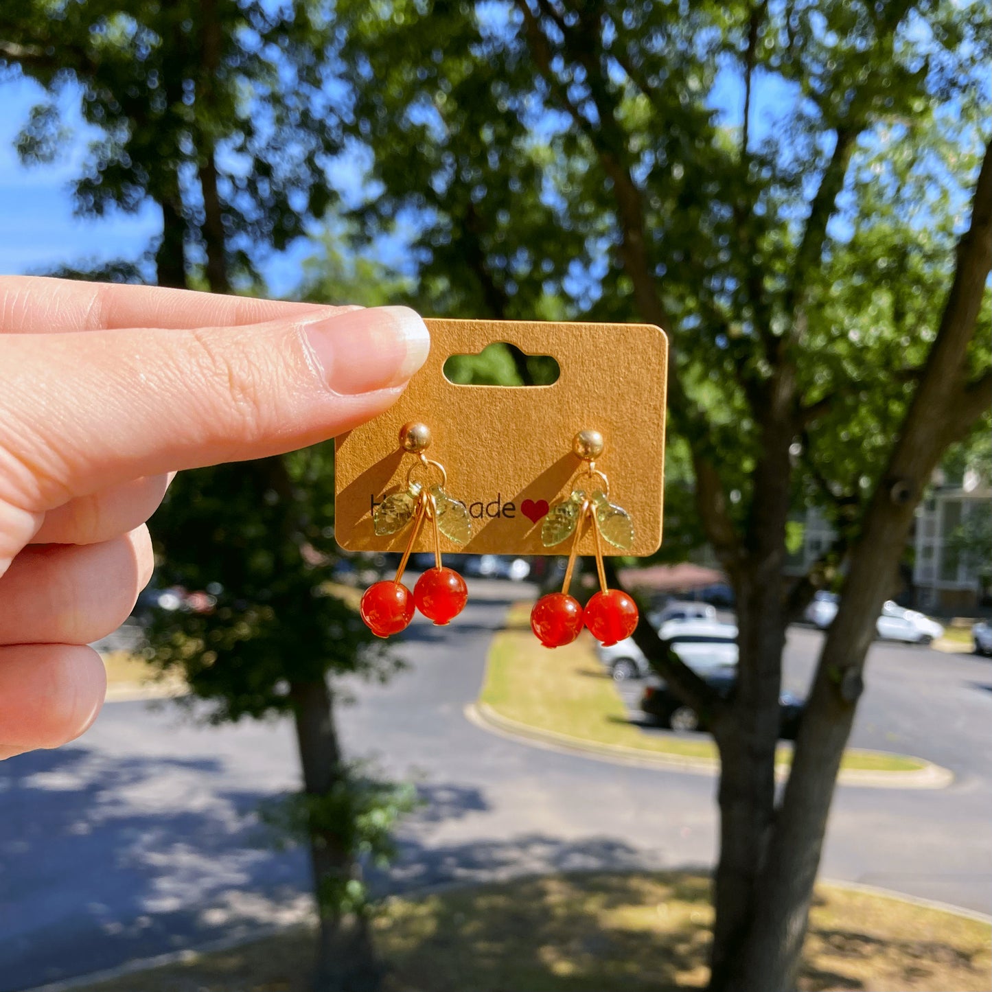 Cherry Carnelian Earrings with Green Leaf Accents