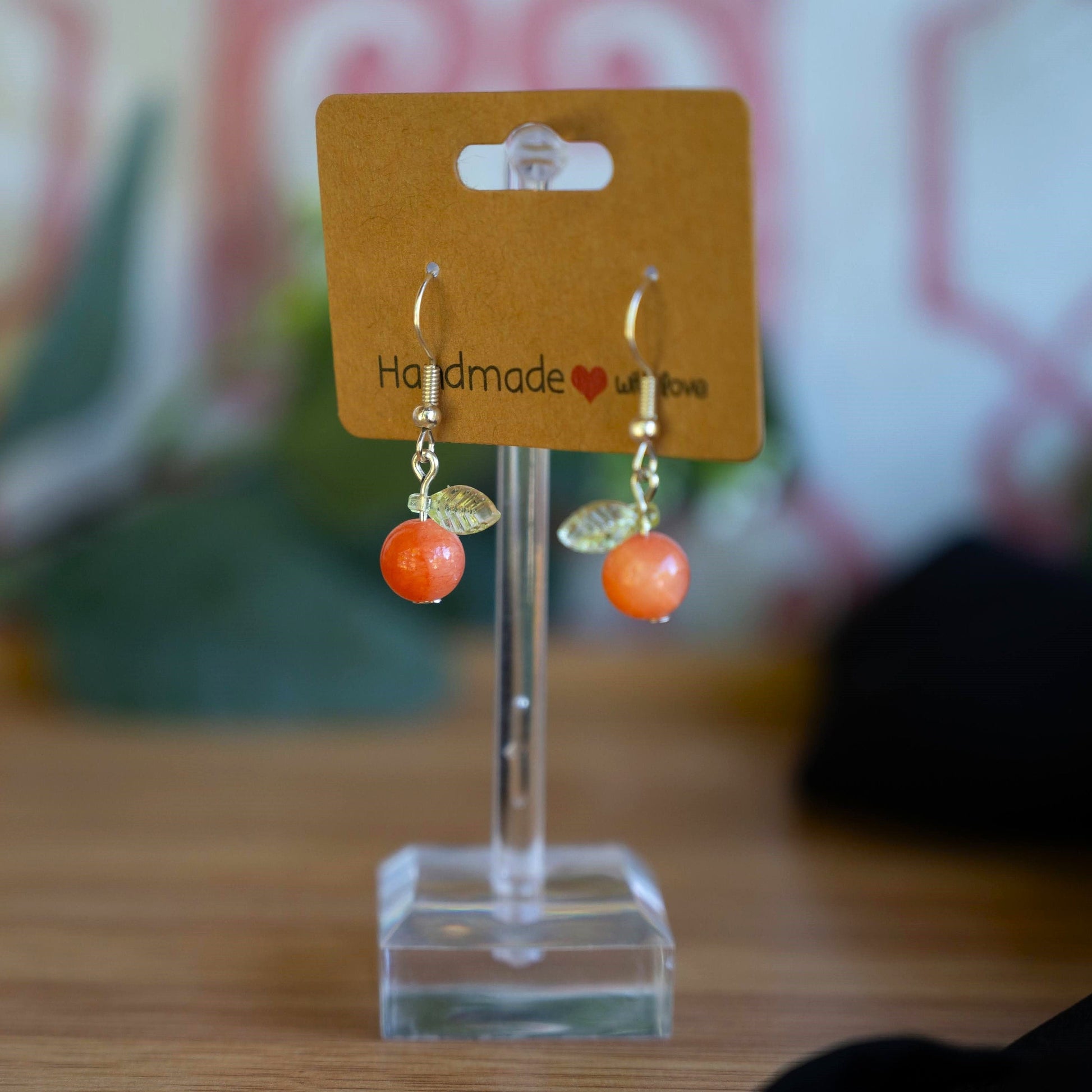 Orange Jade Earrings with Green Leaf Accents