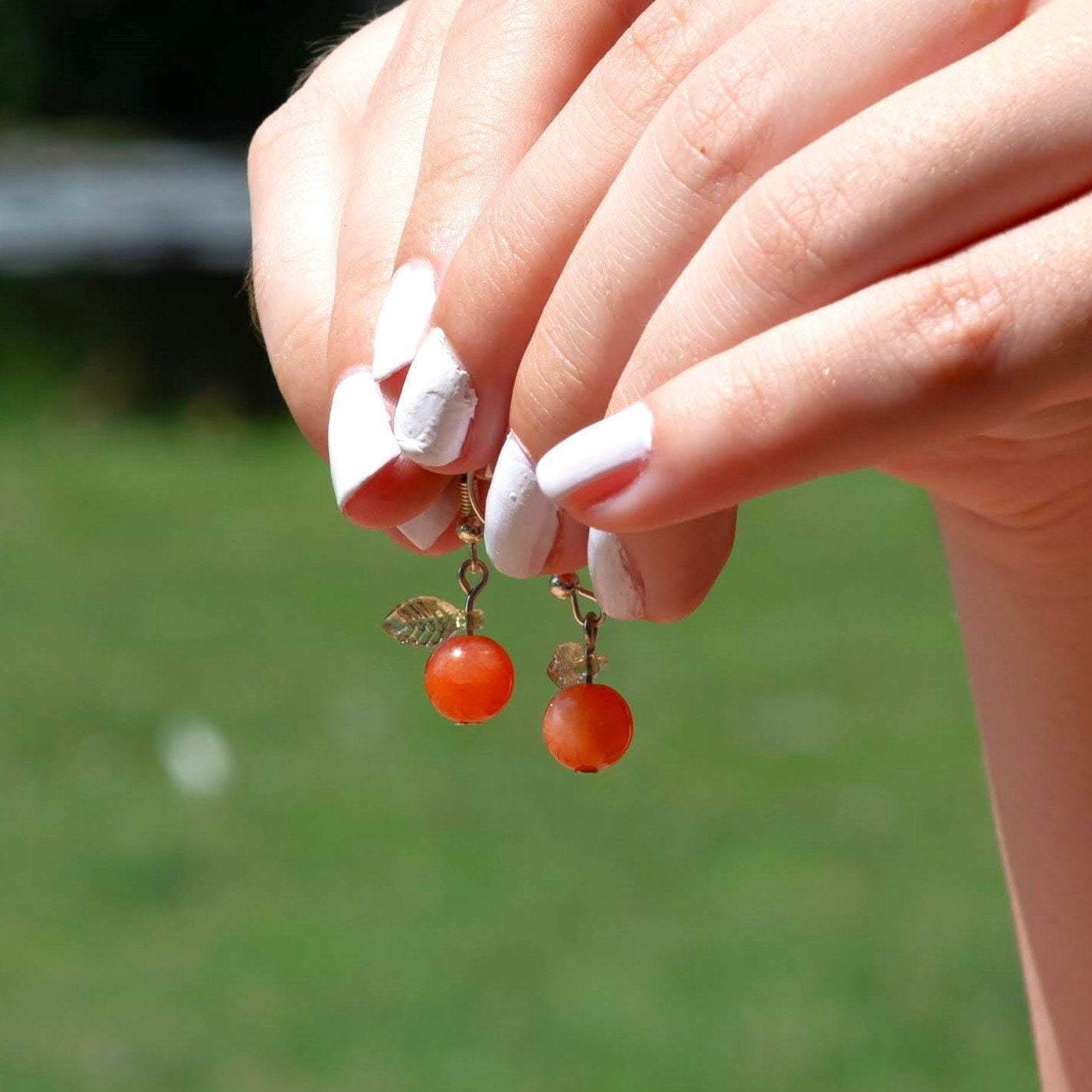 Orange Jade Earrings with Green Leaf Accents