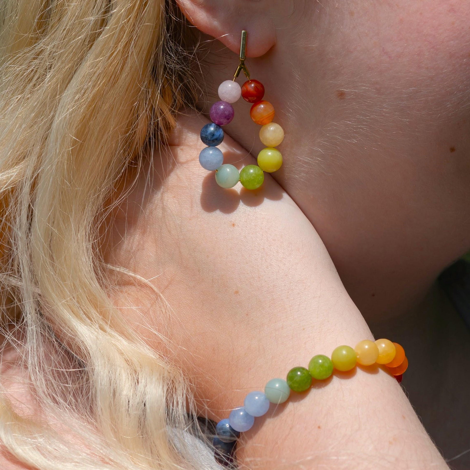 Rainbow Color Gradient Gemstone Bracelet on model with matching earrings