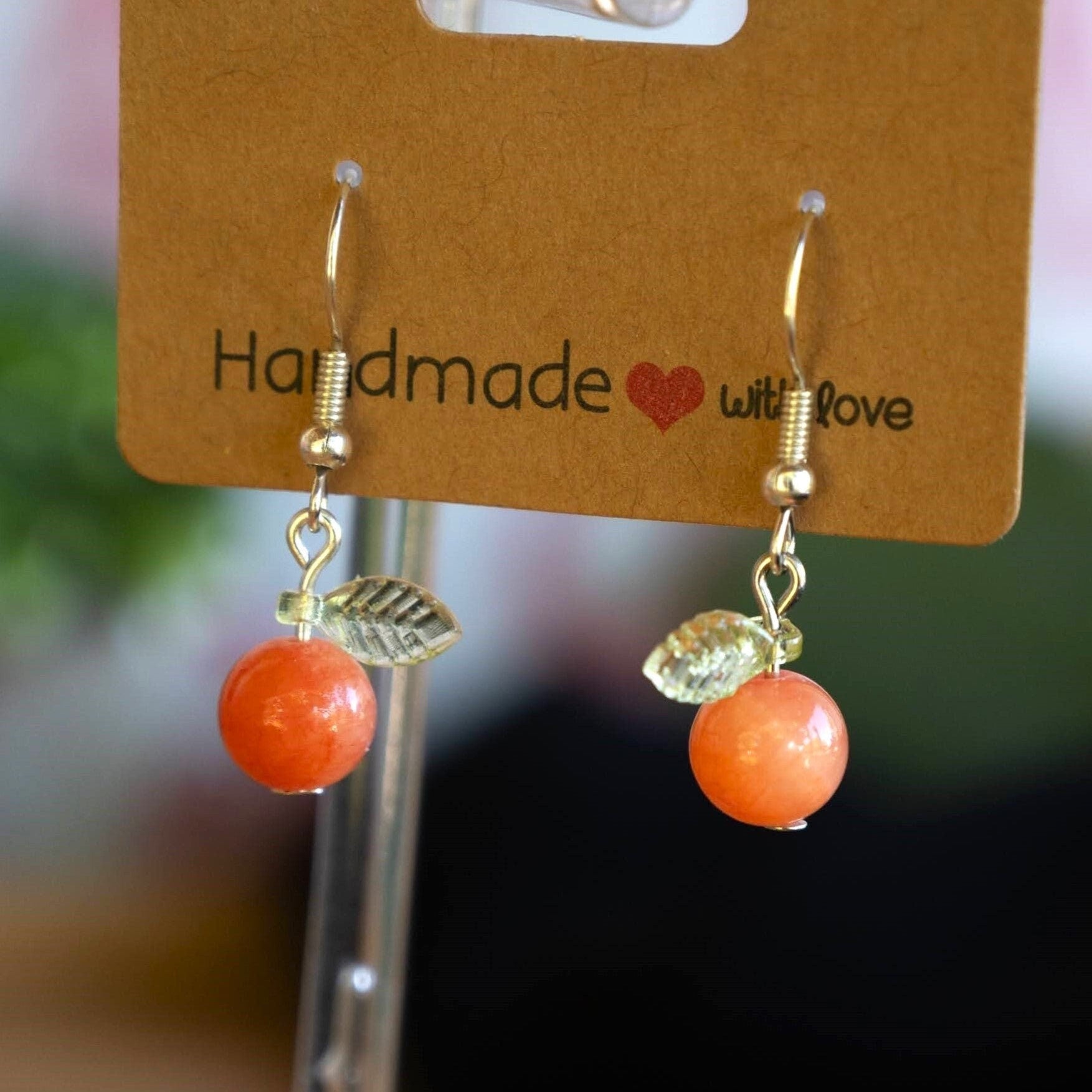 Orange Jade Earrings with Green Leaf Accents